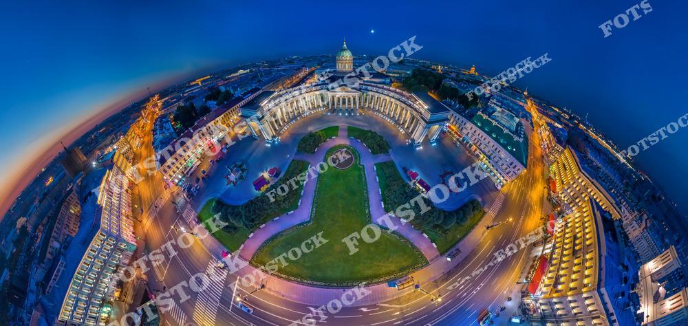 Панорамная фотография Санкт-Петербурга ночью, снятая с высоты птичьего полета. На снимке видны Невский проспект, Казанский собор, освещенные улицы и архитектурные ансамбли исторического центра города. Съемка с дрона позволяет увидеть масштаб городской инфраструктуры, красоту вечернего освещения и панорамные виды Северной столицы России. Фотография передает атмосферу ночного Петербурга, динамику центральных улиц и величие исторической архитектуры. Снимок идеально подходит для туристических публикаций, фотостоков, рекламы, оформления интерьеров и материалов о достопримечательностях Санкт-Петербурга.